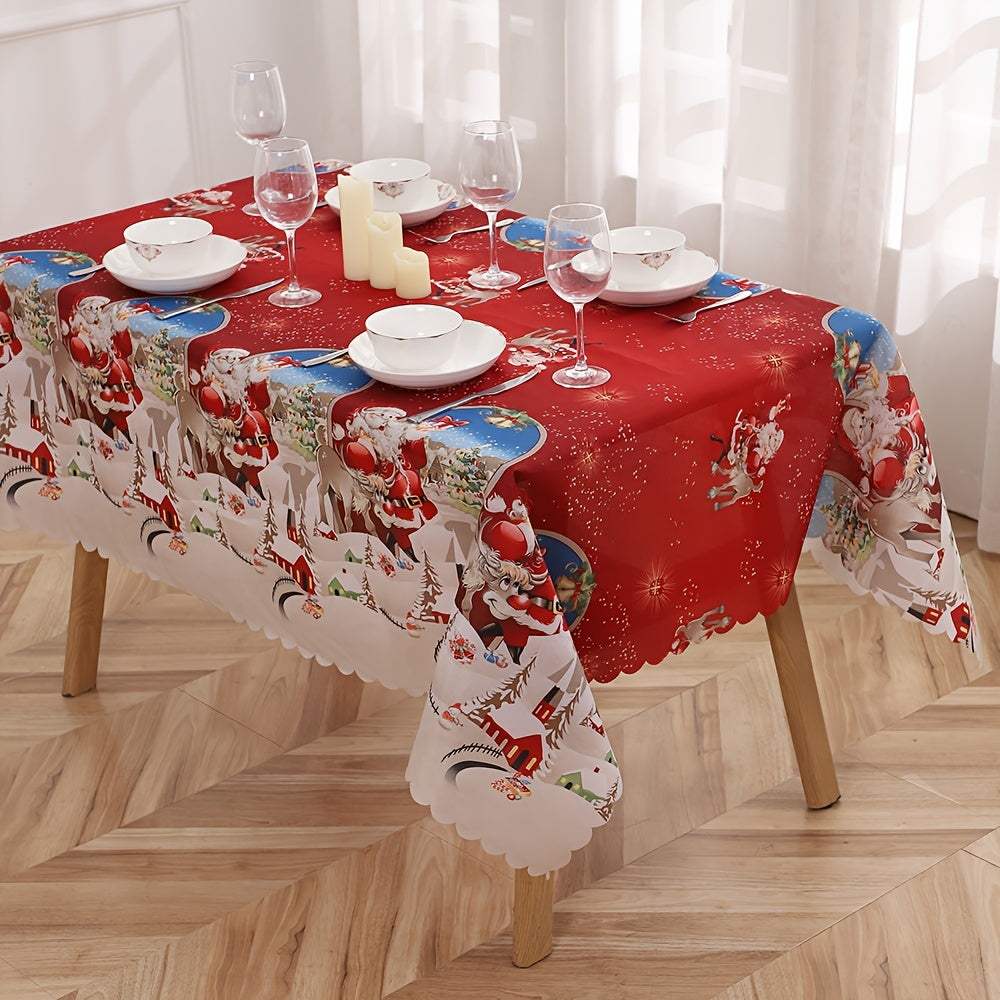 Red polyester Christmas tablecloth with Santa Claus and snowflake pattern on a wooden table with white dishes and glassware