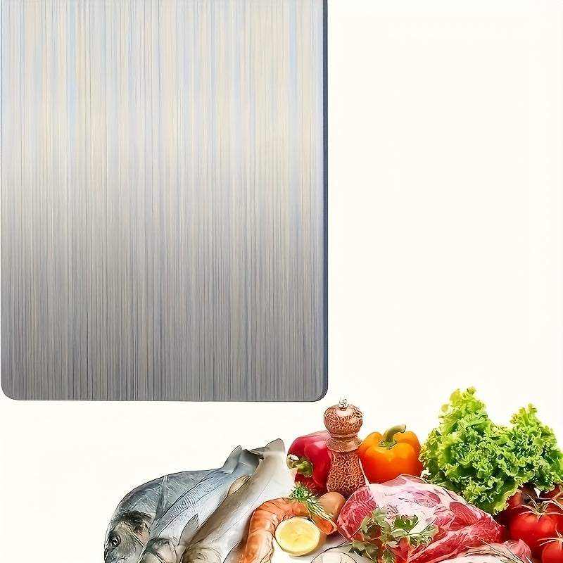Premium high-quality stainless steel chopping board with vegetables, fish, and beef for food prep