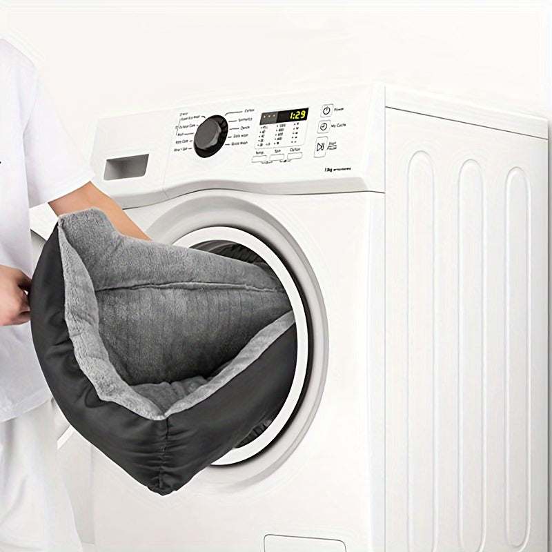 Large washable dog bed for pets being placed into a washing machine for easy cleaning