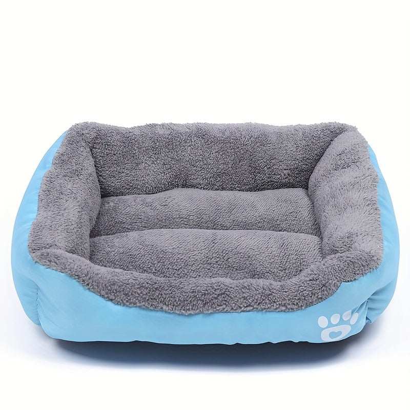 Large washable rectangular dog bed with plush gray interior and blue exterior featuring a paw print design