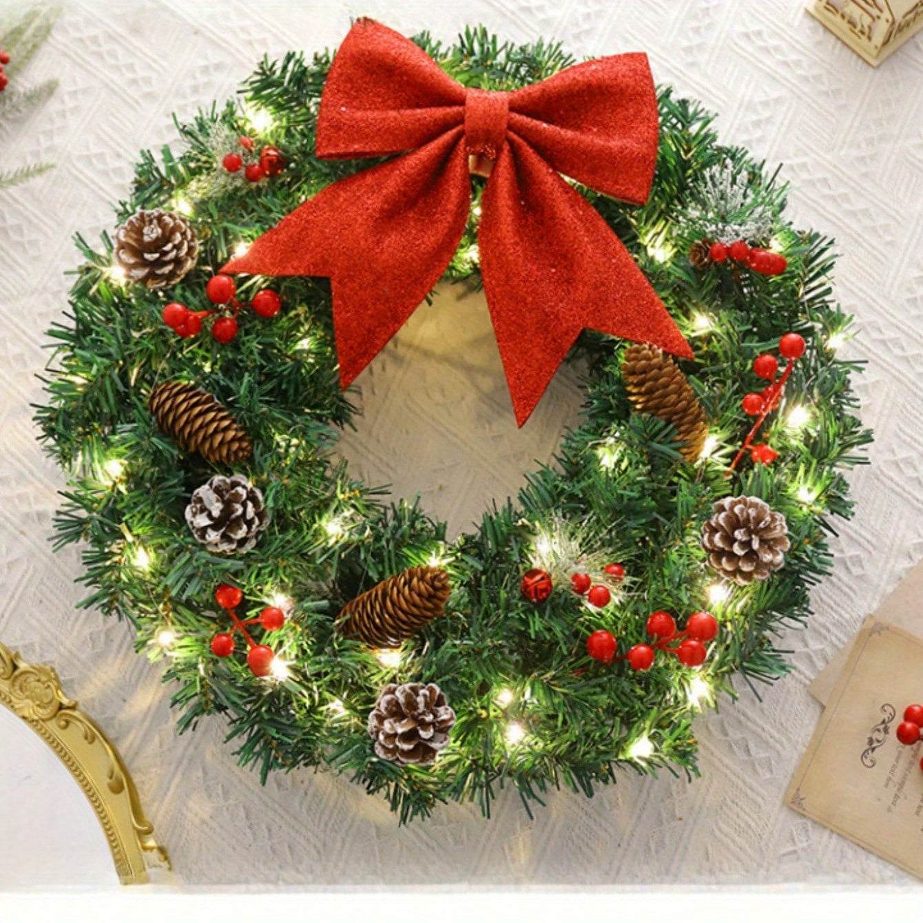 20 Inch Pre-Lit Christmas Wreath with red bow, pine cones, red berries, and warm white lights for holiday door decoration