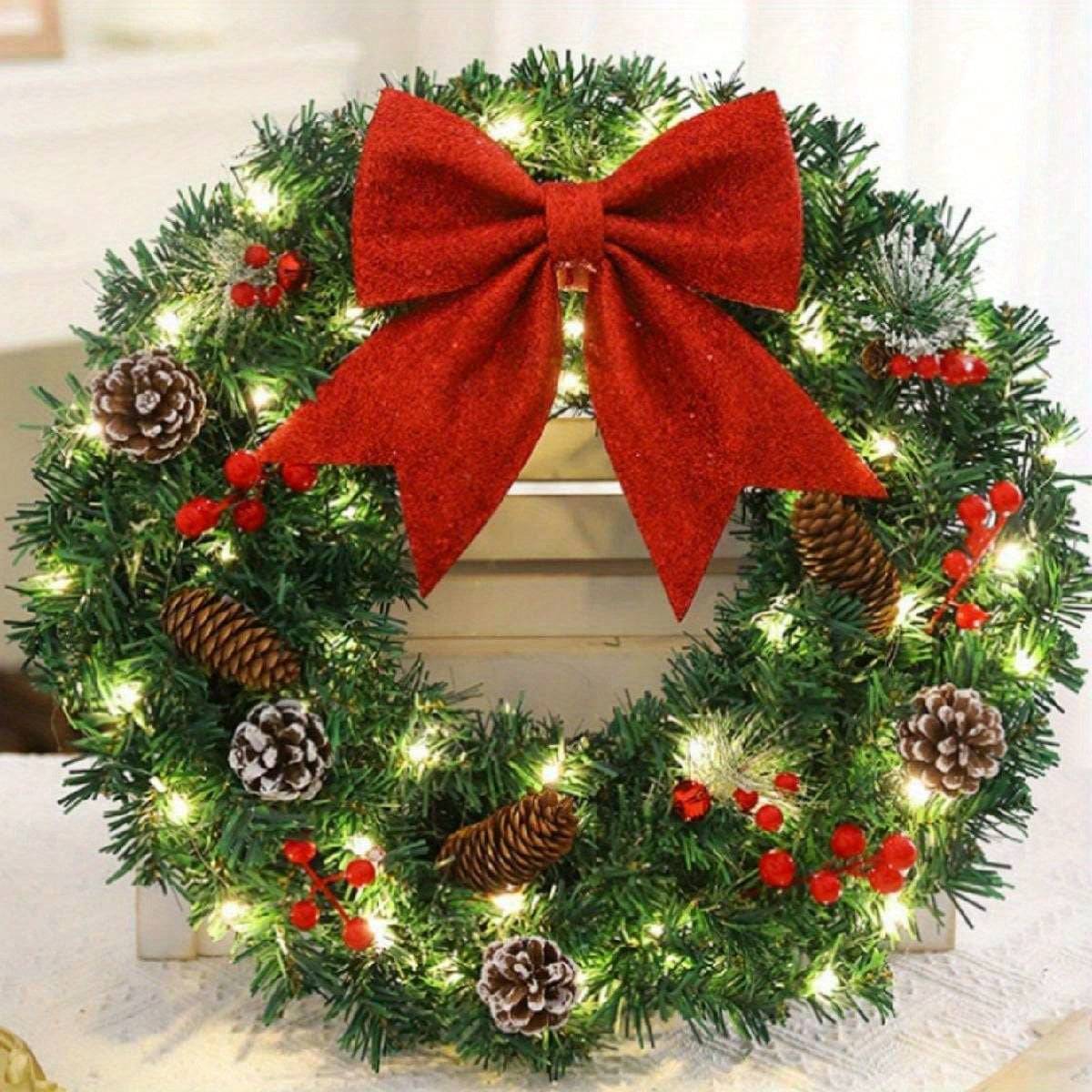 20 inch pre-lit Christmas wreath with pine cones, red berries, red bow, and lights for holiday door decoration