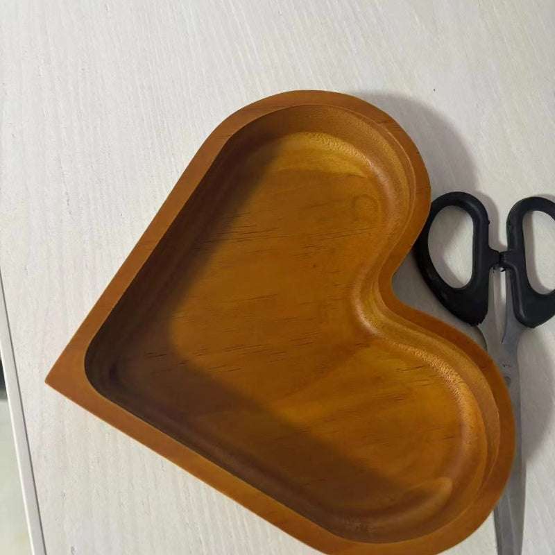 Large heart-shaped wooden tray in walnut-colored acacia wood for serving dried fruits, nuts, and appetizers on kitchen and dining tables