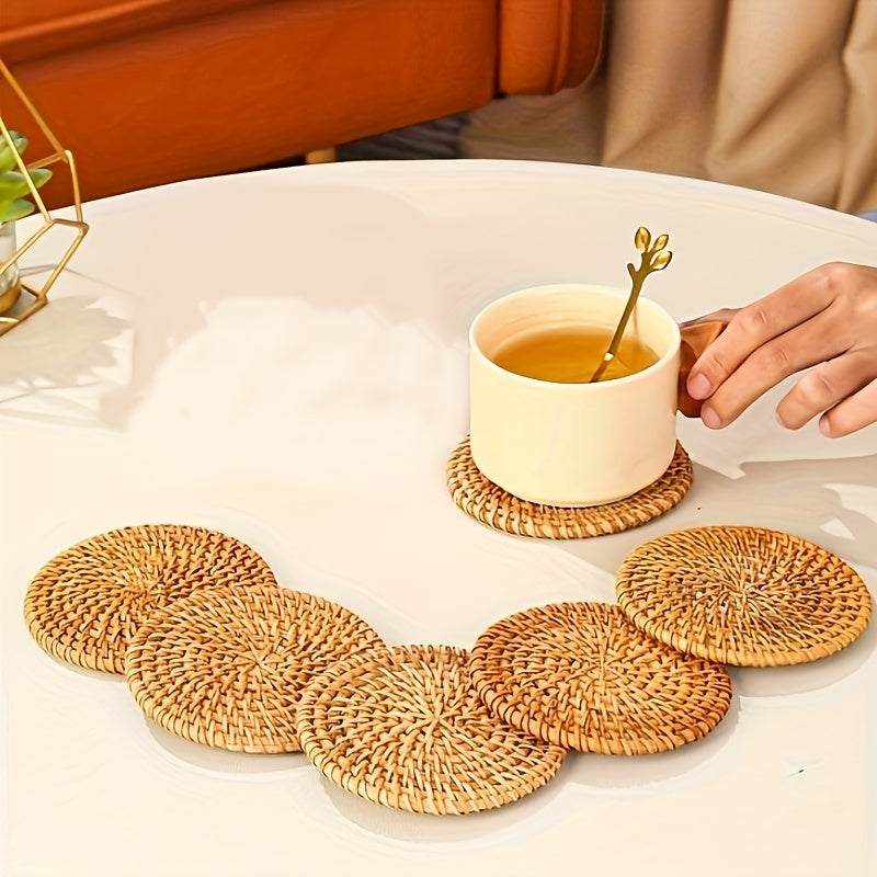 Handmade rattan coasters heat resistant non-slip round drink mats on white table with cup of tea
