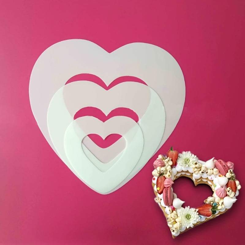 Set of transparent PET plastic heart shape cake molds in various sizes with decorated heart-shaped cake on pink background