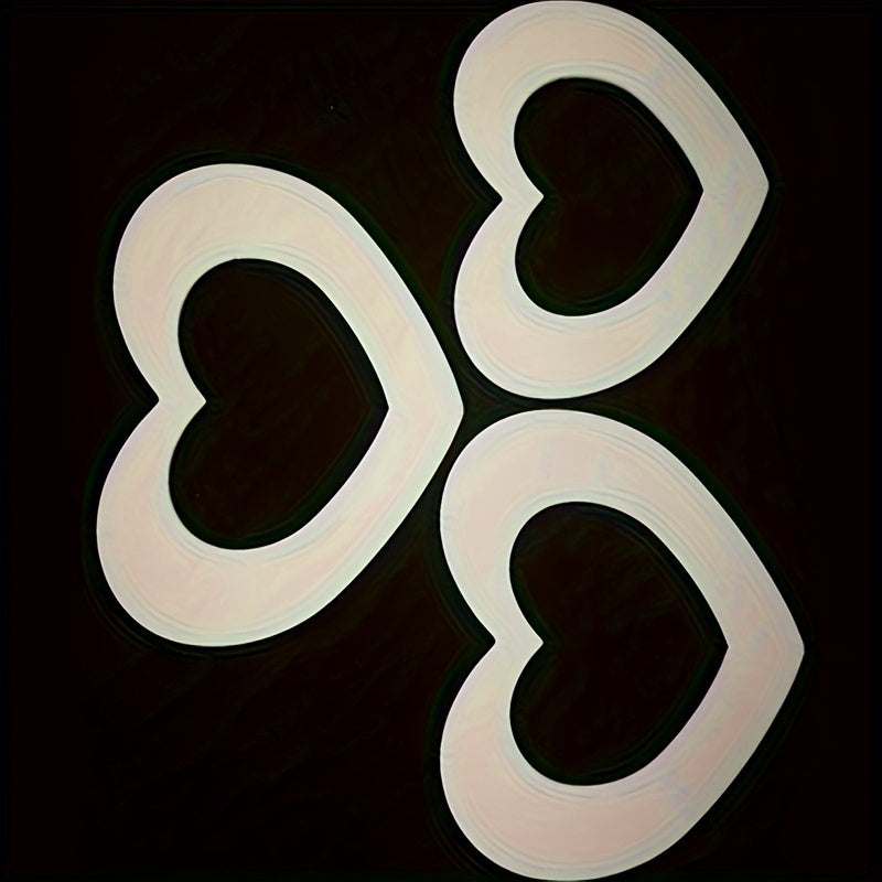 Set of three white heart shape cake molds made of PET plastic for baking decorations