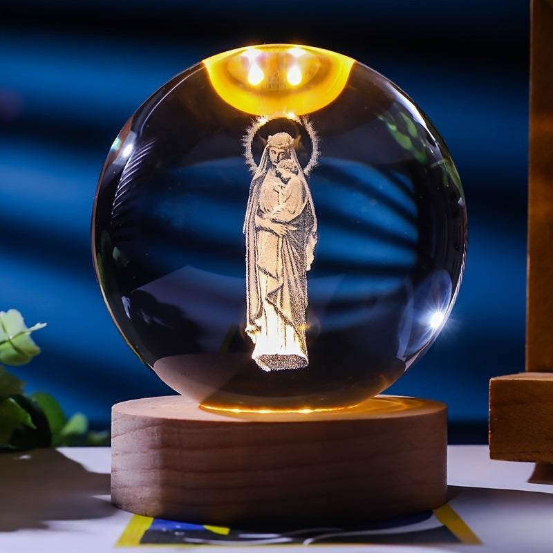 Luminescent crystal ball nightlight with wooden base featuring 3D religious figure design