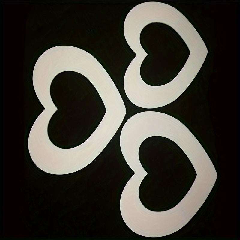 Set of three white PET plastic heart shape cake molds for baking and decorating cakes in various sizes