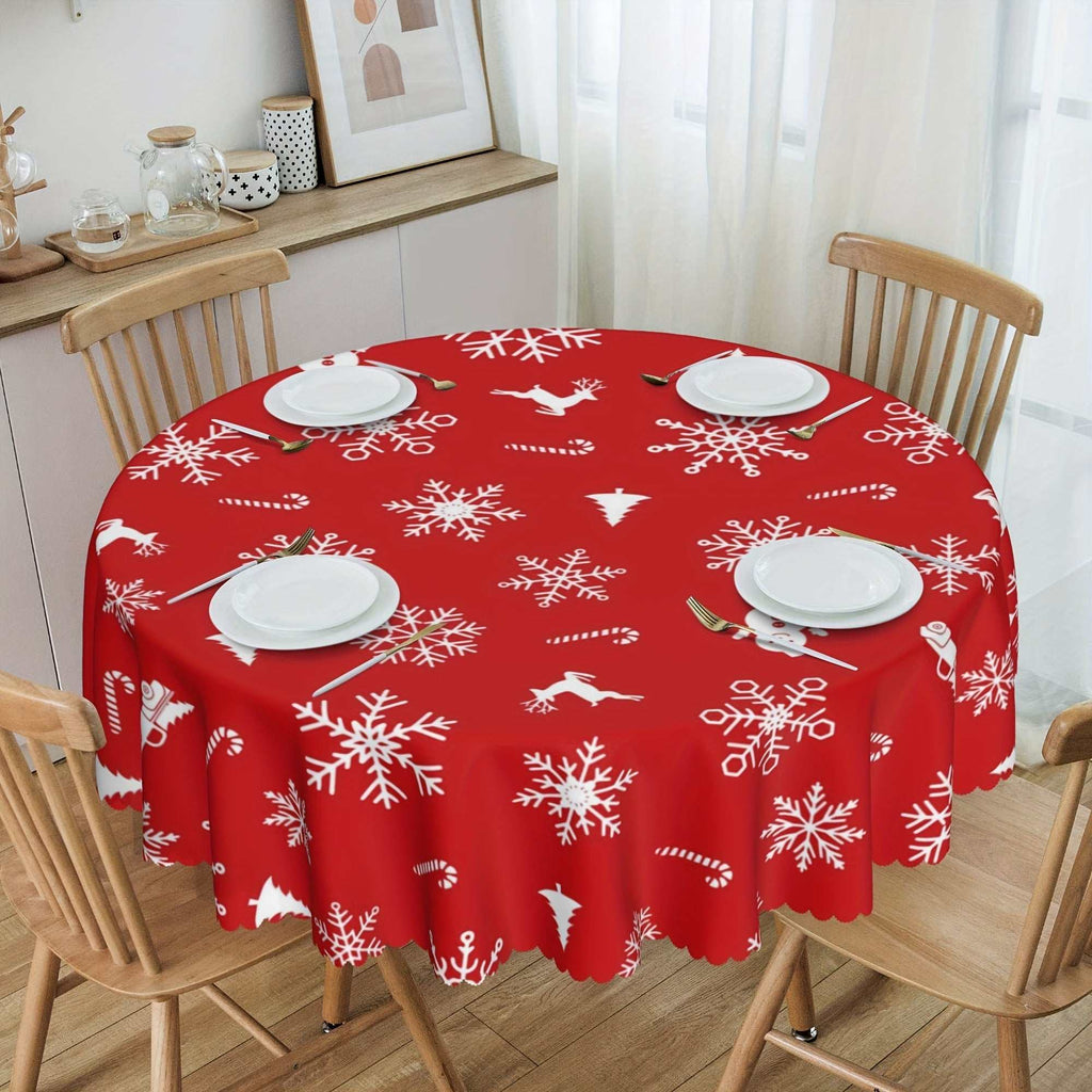 Red polyester round Christmas tablecloth with white snowflake and bell pattern on dining table