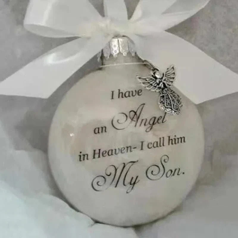 White Christmas memory ball ornament with "I have an Angel in Heaven - I call him My Son" text and angel charm