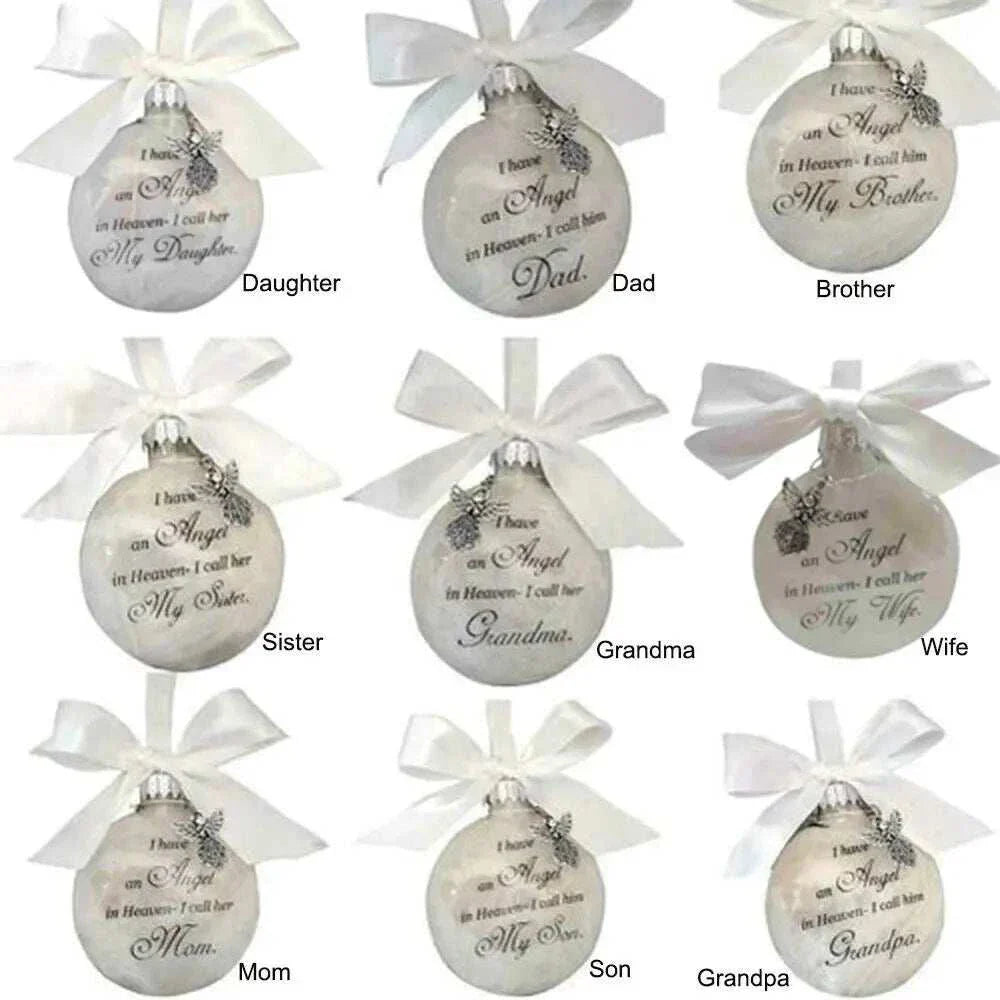 Set of white Christmas Memory Balls ornaments with angel wing charms and personalized memorial messages for family members including Daughter, Dad, Brother, Sister, Grandma, Wife, Mom, Son, and Grandpa.