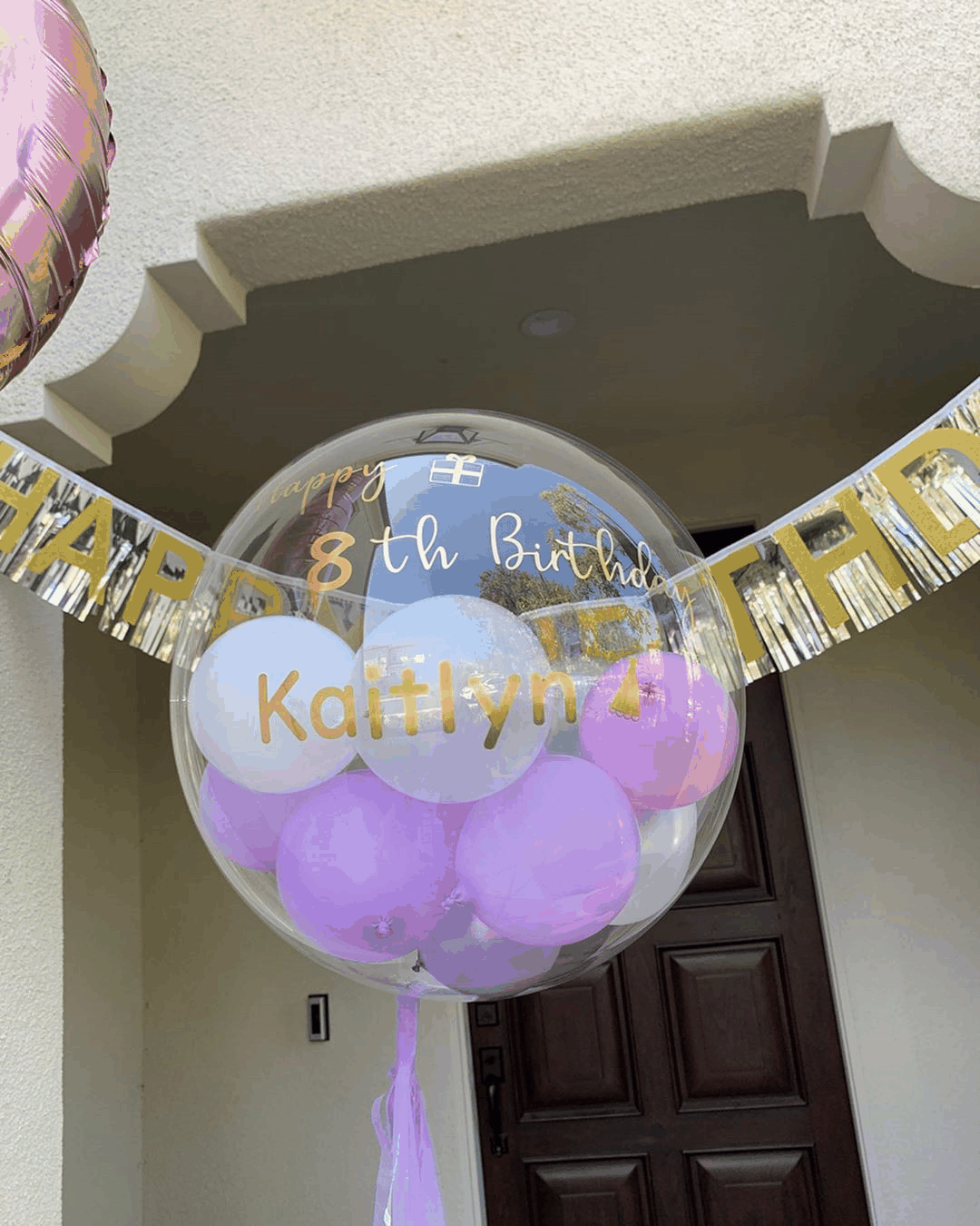 INS New Arrival transparent floating birthday balloon with pink and white inner balloons and gold "Happy 8th Birthday Kaitlyn" text