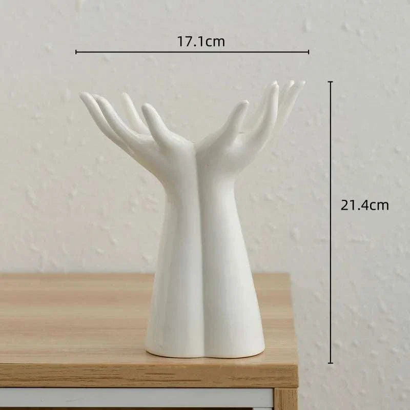 Modern ceramic vase shaped like raised hands for home decoration