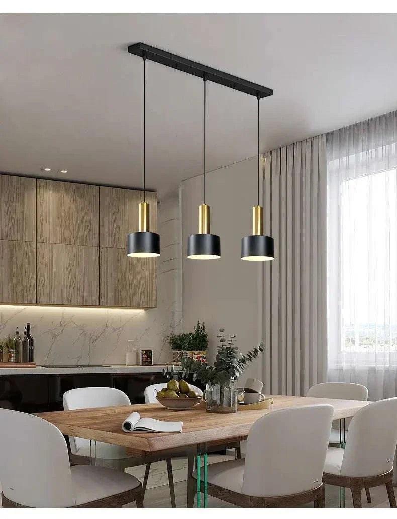 Nordic Simple Three-Chandelier Lamp with sleek metal frame hanging above modern dining table in bright room