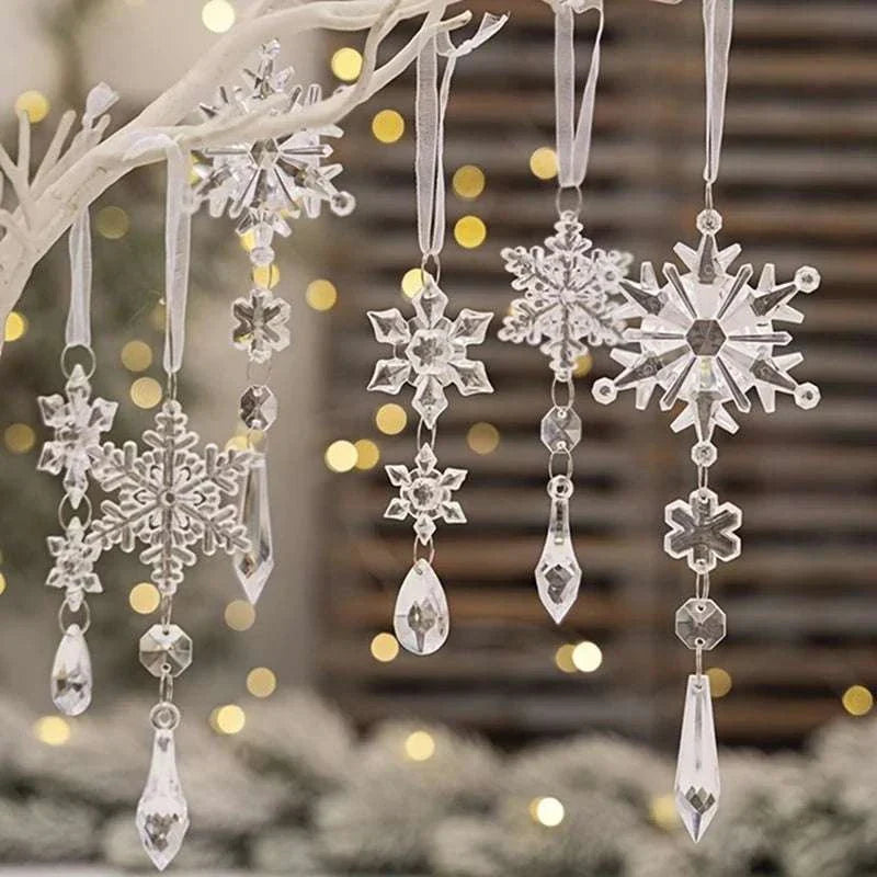 Crystal snowflake Christmas decoration ornaments hanging on white branch with warm bokeh lights background