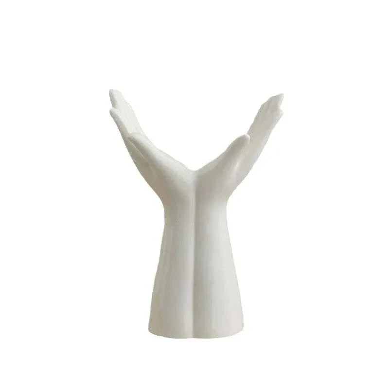 Modern ceramic vase shaped like raised hands for home decoration