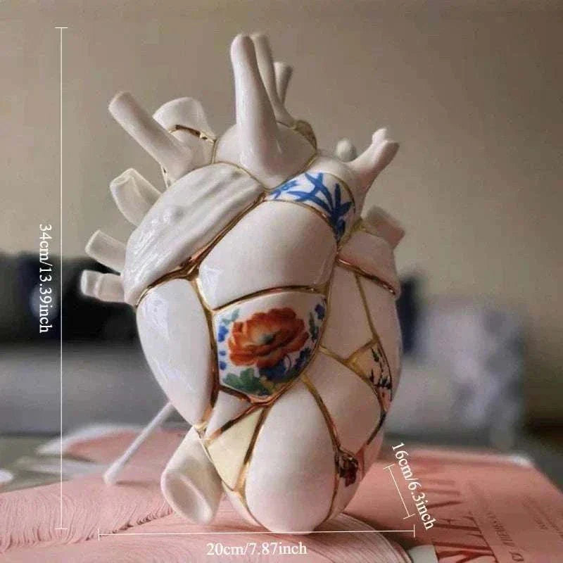 Ceramic vase shaped like a heart with painted floral design and gold accents, measuring 34x20x16cm, minimalist Nordic home decor