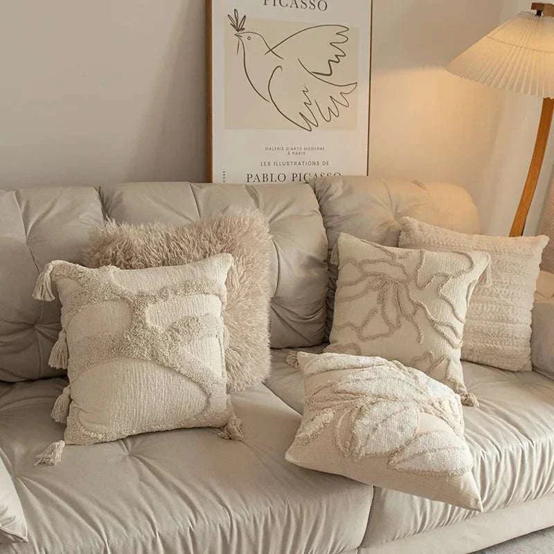 Jacquard embroidery tassel cushion covers in neutral tones on sofa for living room decor