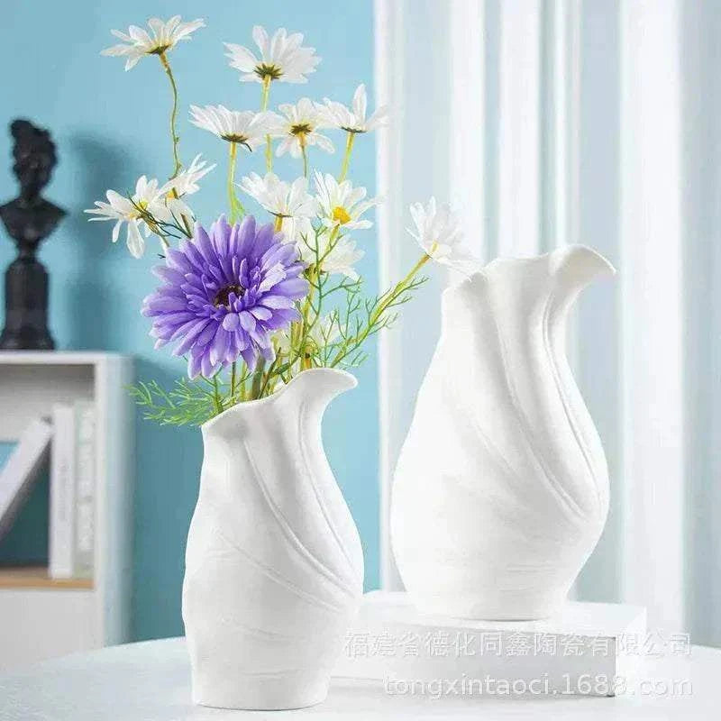 Modern ceramic vase with French minimalist and Nordic design, featuring white matte finish and floral arrangement