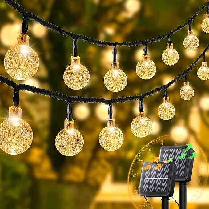 Solar Bubble Ball String Lights glowing warm white LED outdoor garden decoration with solar panel and waterproof design