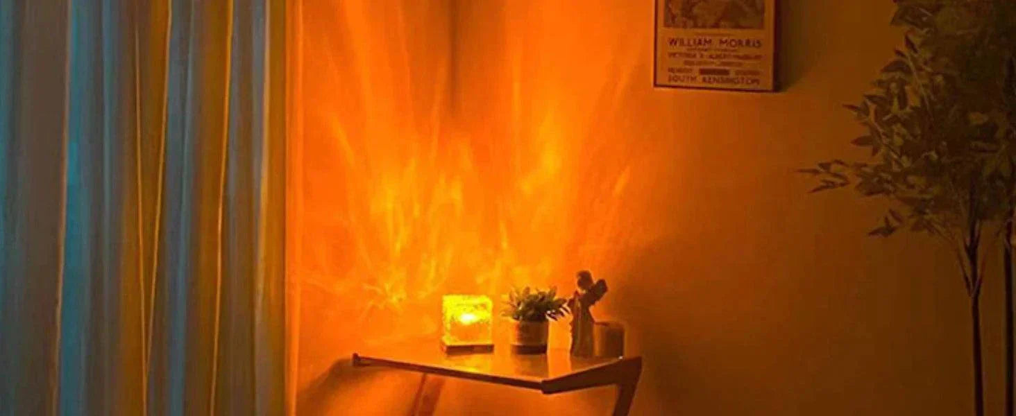 ocean wave projector light casting warm orange glow on wall table with plants and figurine in cozy room