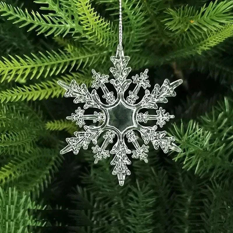 Crystal snowflake Christmas tree ornament hanging on green pine branch holiday decoration
