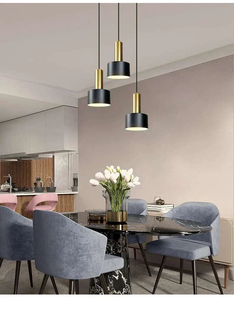 Nordic Simple Three-Chandelier Lamp with black and gold metal design over modern dining table in living room