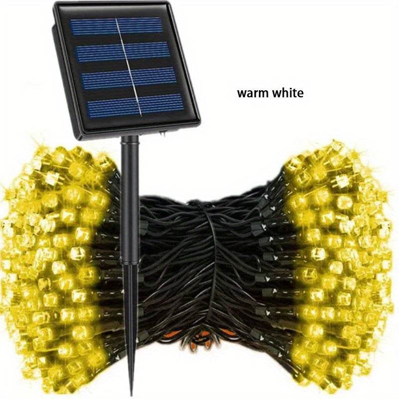 Solar string light with warm white LED bulbs and solar panel for outdoor decoration