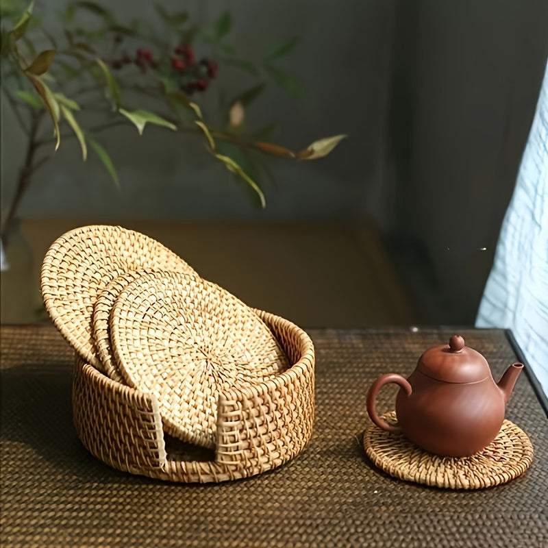 Handmade rattan coasters with non-slip design and heat resistance, displayed with a teapot on a woven tabletop.