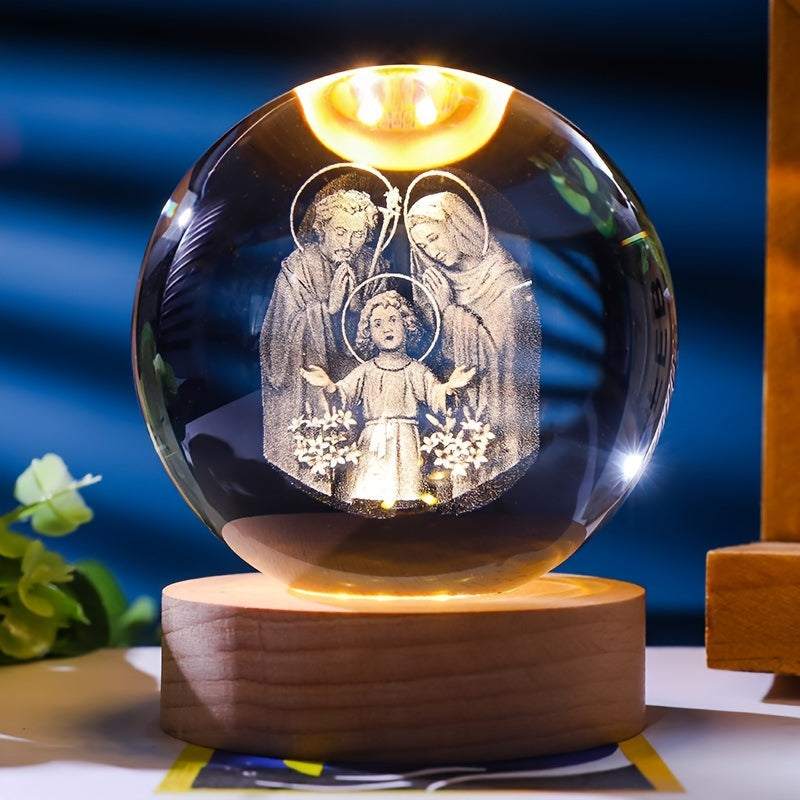 Luminescent crystal ball nightlight with religious 3D engraving on wooden base