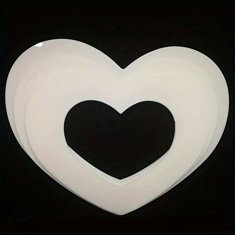 White PET plastic heart shape cake mold baking tool in various sizes on black background