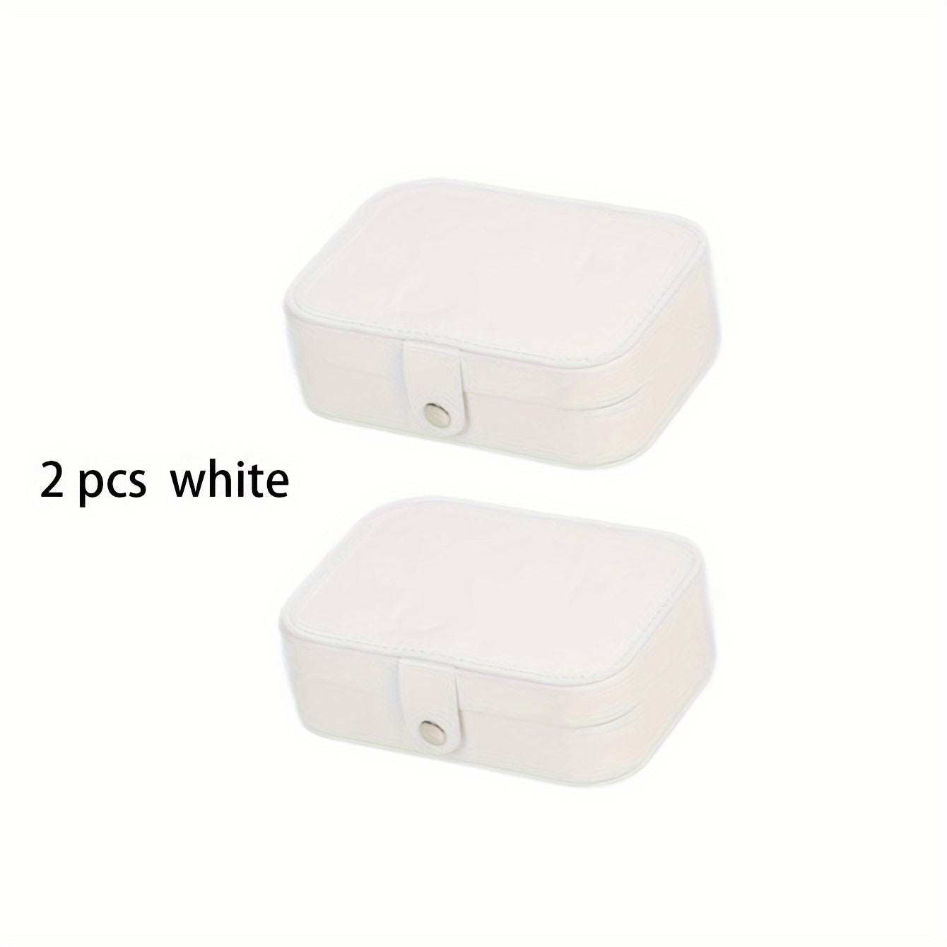 White portable jewelry travel cases with button closure and fabric interior, rectangular leather storage boxes for organizing jewelry on the go.