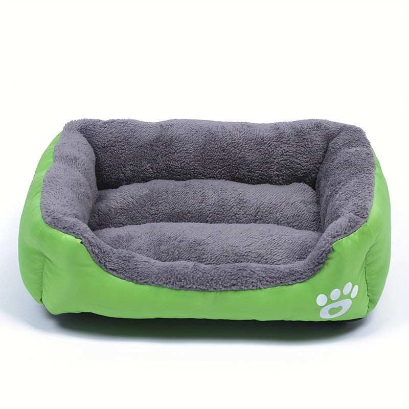 Large washable dog bed with green exterior and plush gray interior featuring paw print design